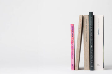 Spines of 5 books on a white background.